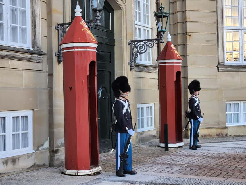 Copenhagen Combo: Walking Tour, Harbor Ferry & Royal Guards - Starting beneath Copenhagen Central Station’s famous clock