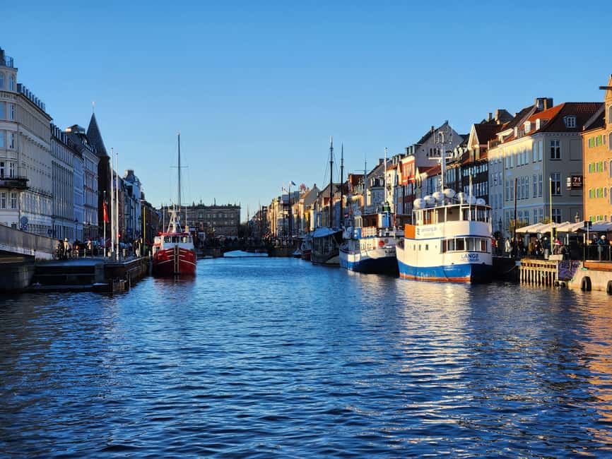Copenhagen Combo: Walking Tour, Harbor Ferry & Royal Guards - Nyhavn from the street, then the long walk east