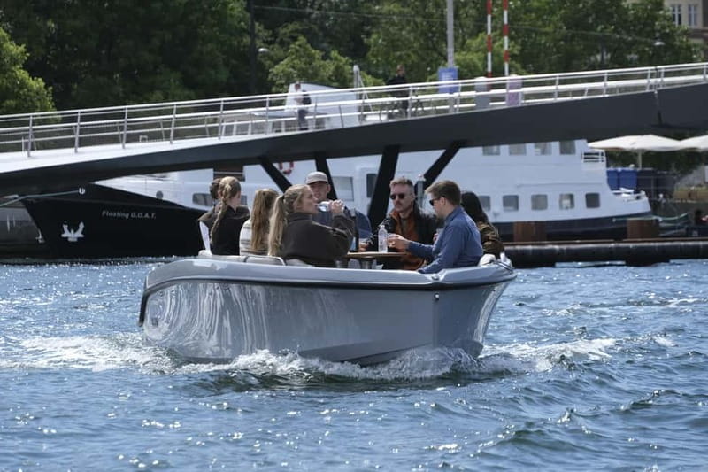 Copenhagen: Electric Canal Tour with Guide and Hot Drink - What the captain adds to the hour