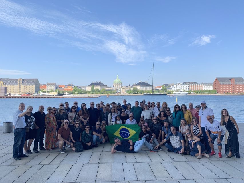 Copenhagen: Private City Walking Tour with Canal Tour Ticket - Reaching Nyhavn and changing from street to water